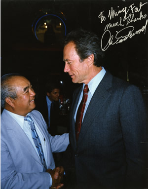 Wing Fat shaking hands with Clint Eastwood.  Inscribed: 